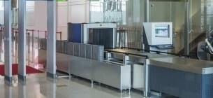 view of security section at airport where hand luggage is scanned, the area is empty