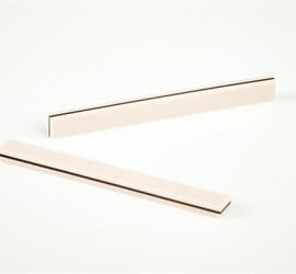 view of two carbon connectors laid out on a white background.