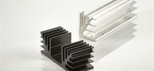view of two flatback heat sink profiles with gap one lying down and the other standing upright on a white background
