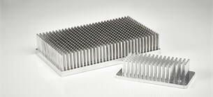 two different sized powerblock heat sinks on a white background