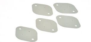collection of die cut gaskets on a white background