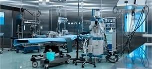 view of an empty medical laboratory, with a stretcher and various medical electronic equipment