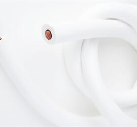 view of flexible cable in white tubing on a white background.